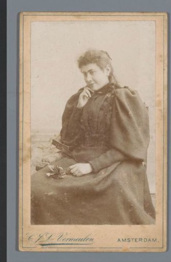 Portrait of an unknown woman with a rose on her lap