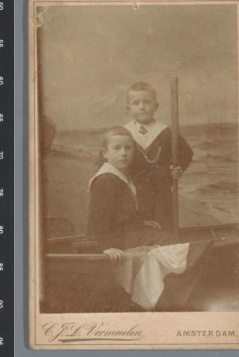 Portrait of two unknown boys, dressed as sailors in a boat