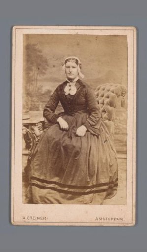 Portrait of an unknown seated woman with a cap