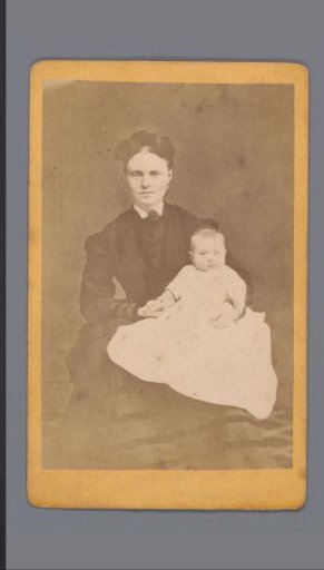 Portrait of an unknown woman with a baby on her lap