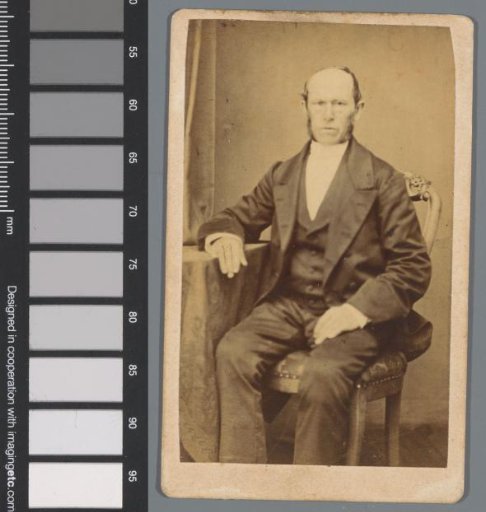 Portrait of an unknown man at a table