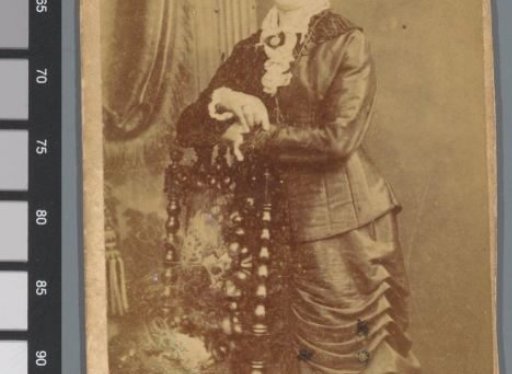 Portrait of an unknown woman at a chair