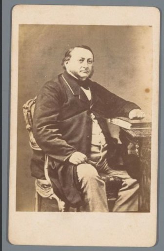 Portrait of an unknown man at a table