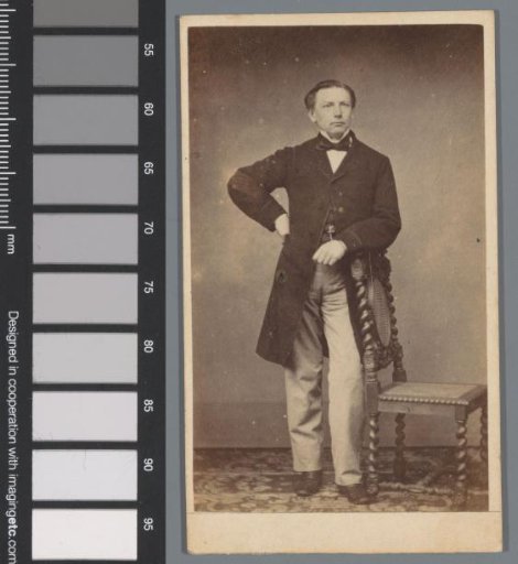Portrait of an unknown man at a chair