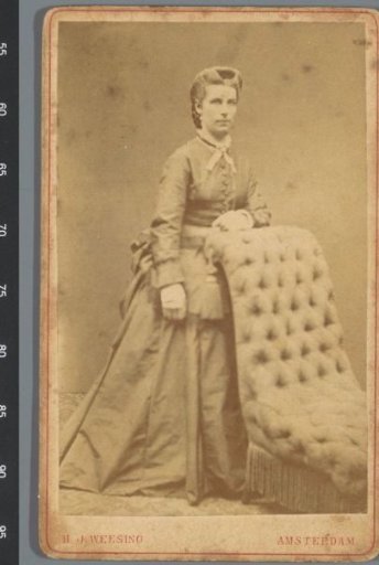 Portrait of an unknown woman by a chair