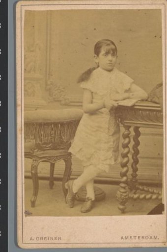 Portrait of an unknown boy with furniture