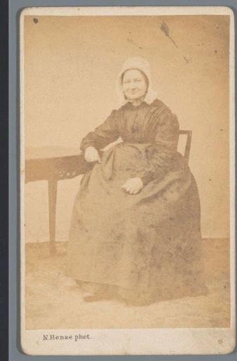 Portrait of an Unknown Woman at a Table