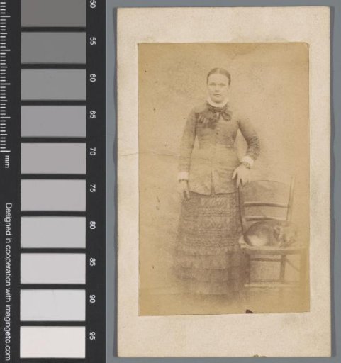 Portrait of an unknown girl with a dog on a chair