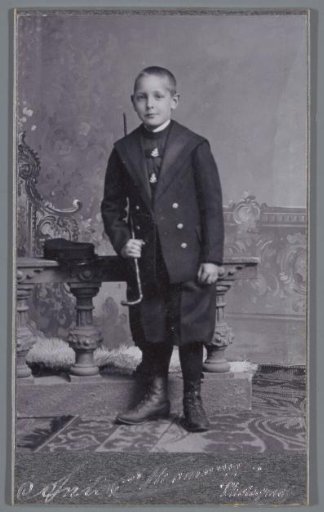 Portrait of an unknown boy with a walking stick
