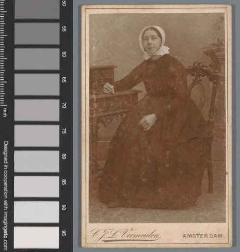 Portrait of an unknown woman at a desk