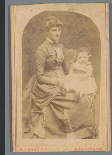 Portrait of an unknown woman with a child on her lap