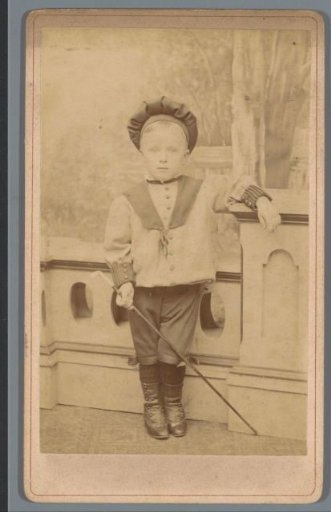 Portrait of an unknown boy with walking stick