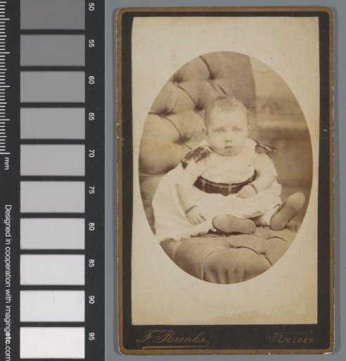 Portrait of an unknown baby on a chair