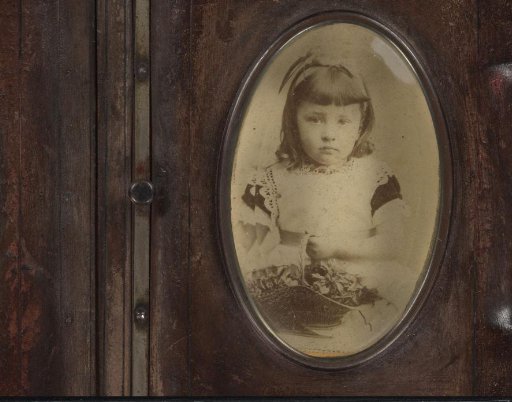 Portrait of a girl with a flower basket in hand