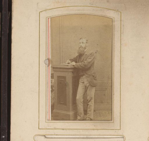 Portrait of a standing man writing with glasses