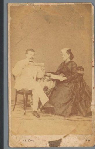 Portrait of an unknown man and woman at a table