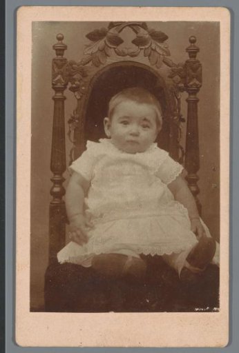 Portrait of an unknown baby on a chair