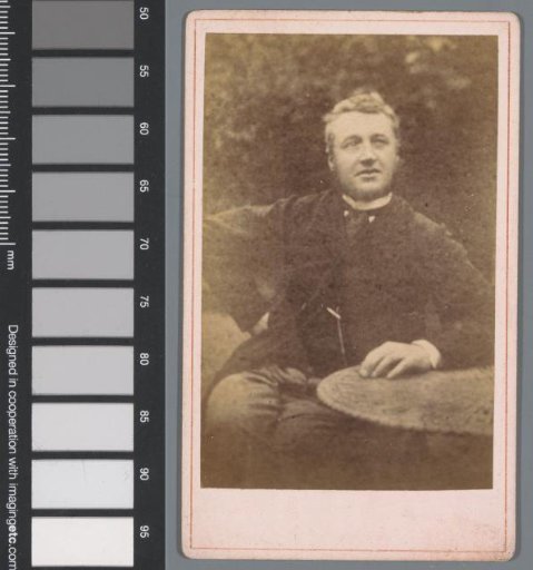 Portrait of an unknown man at a table