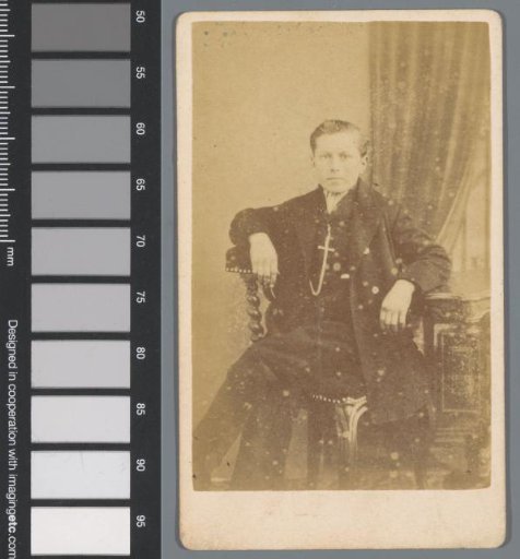 Portrait of an unknown young man at a table