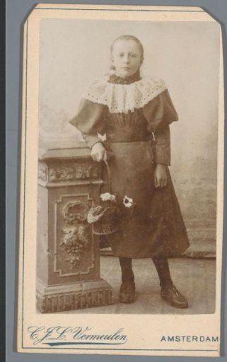 Portrait of an unknown girl with a wicker basket of flowers