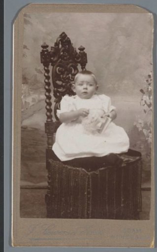 Portrait of an unknown infant on a chair