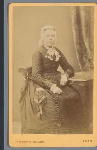 Portrait of an Unknown Woman with a Cap, Seated at a Table