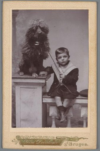Portrait of an unknown boy, named Robert, with a dog