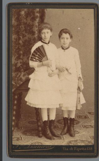 Portrait of two unknown children with fans
