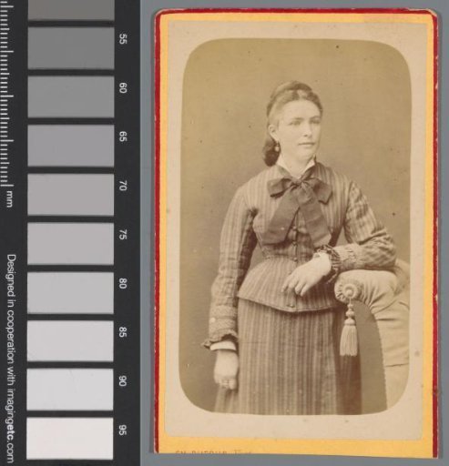 Portrait of an unknown woman by a chair