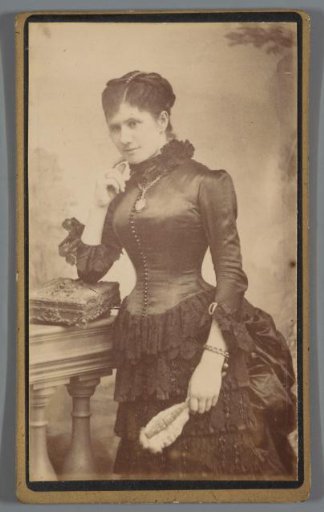 Portrait of an unknown woman by a table