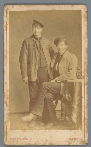 Portrait of two unknown men with fishermen's caps