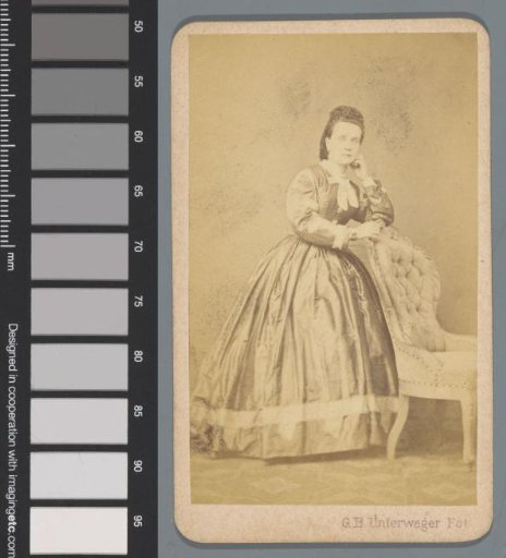 Portrait of an unknown woman by a chair