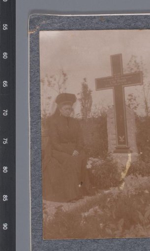 Portrait of an unknown woman at the grave of Otto Brand