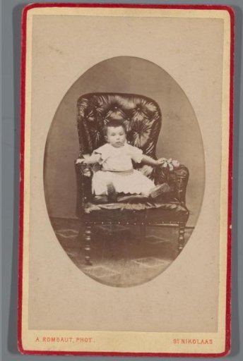 Portrait of an Unknown Child with a Flower in an Armchair