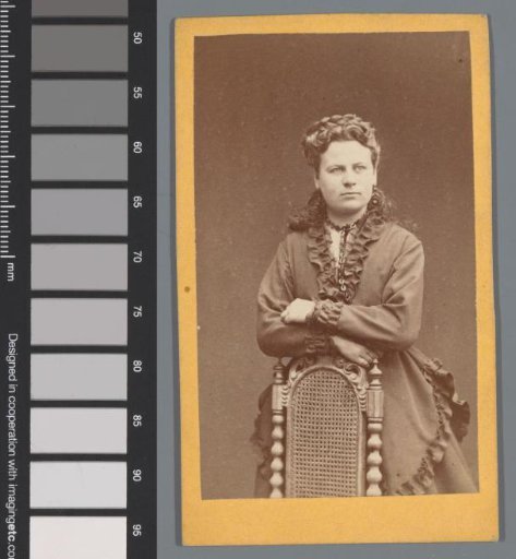 Portrait of an unknown woman by a chair