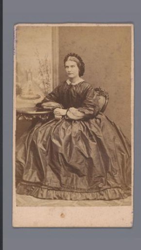 Portrait of an unknown woman at table