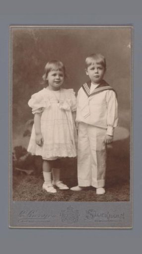 Portrait of two unknown children dressed in a sailor suit