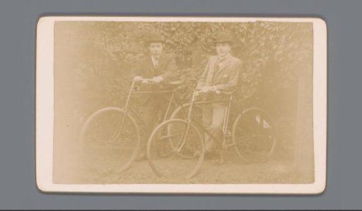 Two Men Outdoors with Bicycles