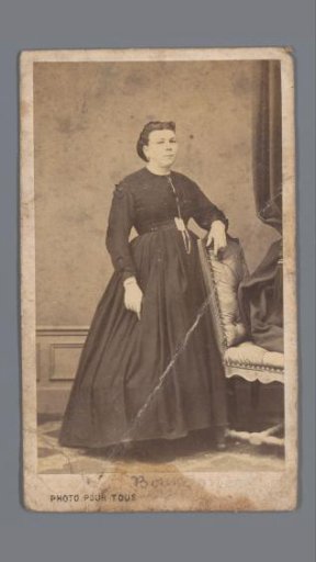 Portrait of an unknown woman by a chair
