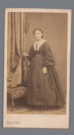Portrait of an unknown woman by a chair