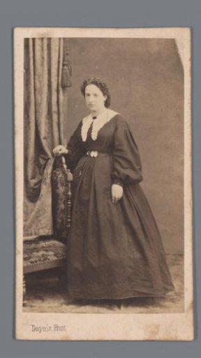 Portrait of an unknown woman by a chair