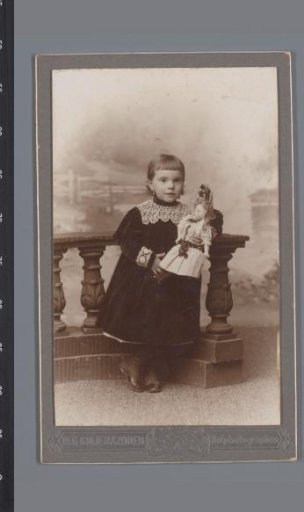 Portrait of an unknown girl with a doll