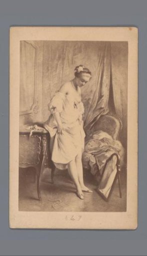 Photographic reproduction of a painting of a woman looking at shoes in a mirror