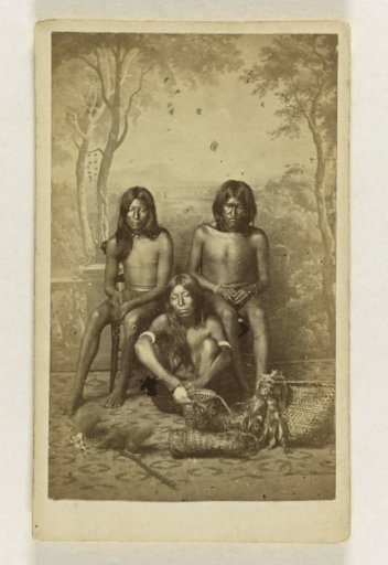 Portrait of three unknown Surinamese Arawaks against a painted background, Paramaribo