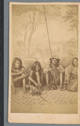 Portrait of four unknown Surinamese Arawaks against a painted background, Paramaribo