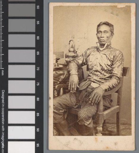 Portrait of an unknown man at a table