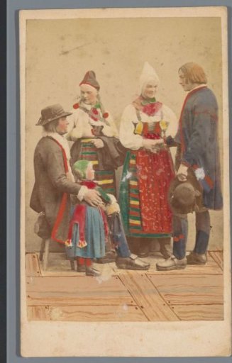 Group portrait of five people in costume from Rättvik, Sweden