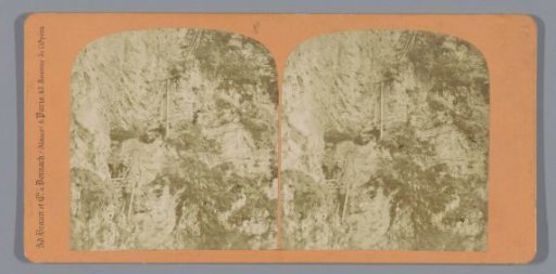 Men climbing a rock wall with ladders, Leuk