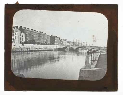 View of river in town, possibly in England