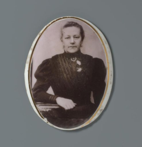 Portrait of an unknown woman on a ceramic oval plaque from a grave